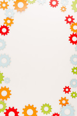 Sticker - top view of multicolored gears isolated on white with copy space