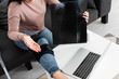 © LIGHTFIELD STUDIOS - cropped view of woman showing x-ray of leg on online consultation with doctor on laptop