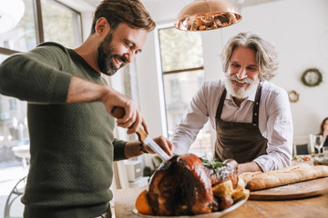 happy father and his adult son celebrating christmas