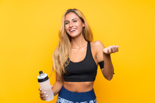 Young Sport Woman With A Bottle Of Water Over Isolated Background