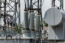 Three Phase Distribution Transformer In An Electrical Substation, Current Transformer, Close Up On The Ceramic Insulators, Elements Of A Substation