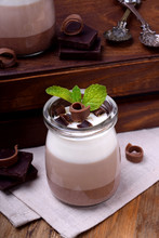 Three Chocolate Mousse Dessert In A Glass Jar With Mint