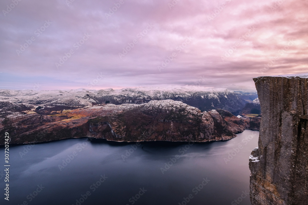 The famous Preikestolen Pulpit Rock over the Lysefjord, beautiful colors at sunset, Ryfylke, Rogaland, Norway - obrazy, fototapety, plakaty 