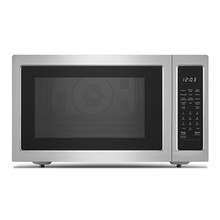 Microwave Oven Isolated On White Background. Front View Of Brushed Stainless Steel Over-The-Range Countertop Convection Microwave Oven With Control Lockout Option. Kitchen And Domestic Appliances
