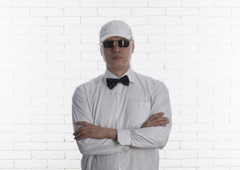 Poster - studio portrait of a businessman in a white shirt and with a bow-tie