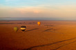 High angle shot of three air balloons at sunrise in Masai mara national park in Kenya
