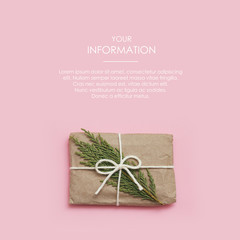 Wall Mural - Small parcel wrapped in craft paper and tie blue thread. Dirty pink background. Web article template. Long header banner format. Sale coupon. Visit card. Your information. Text space.