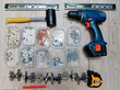 © Tricky Shark - Tools for assembling furniture and necessary tools. Threaded furniture hardware, hammer (mallet), screwdriver, tape measure, pencil, fasteners, couplers, dowels, eccentric...Various furniture fittings