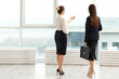 © Pixel-Shot - Beautiful businesswomen discussing issue in office