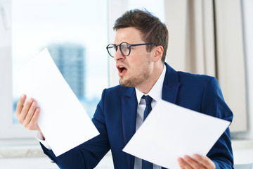 Poster - businessman holding a blank sign