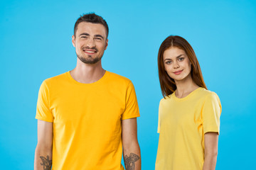 Wall Mural - cheerful young couple in t-shirts