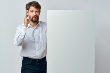 Poster - young man pointing at blank screen