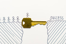 Group Of Tiny People Walking Through A Golden Key To Success