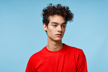 Wall Mural - portrait of young man on background of blue sky