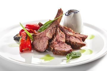 Sticker - Grilled Lamb Rack with Baked Vegetables on White Restaurant Plate