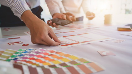 Cropped shot of young UX graphic designer team working on smartphone template