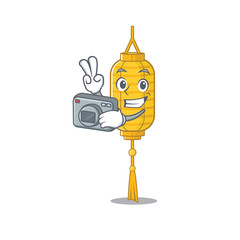 Sticker - a professional Photographer lamp hanging cartoon character with a camera