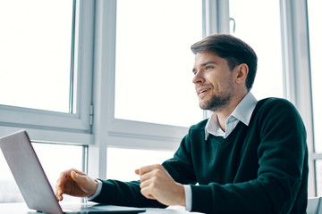 Wall Mural - businessman working on laptop in office