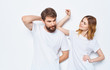 © SHOTPRIME STUDIO - cheerful young couple in t-shirts