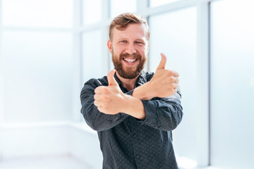 Wall Mural - happy businessman showing thumbs up. photo with copy space