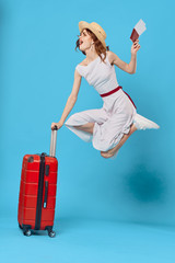 Wall Mural - young woman with suitcase