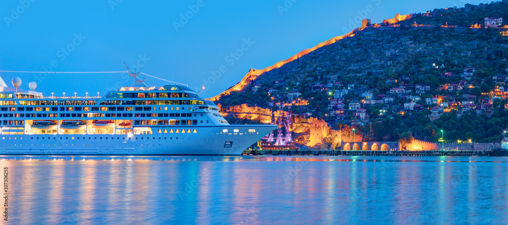 Beautiful white giant luxury cruise ship on stay at Alanya harbor - obrazy, fototapety, plakaty 