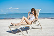 © SHOTPRIME STUDIO - young woman with laptop on the beach