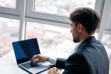 Poster - businessman working on laptop in the city