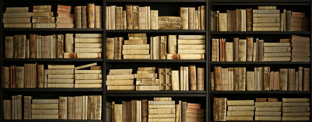 Wall Mural - antique books on old wooden shelf.