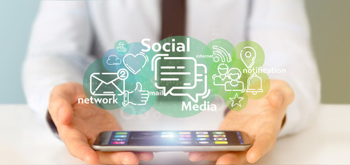 Businessman holding a cloud of social media network icon
