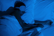 Woman Sleeping With A Sleep Mask On Her Eyes