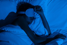 Woman Sleeping With A Sleep Mask On Her Eyes