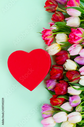Fresh tulips flowers with heart