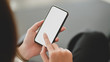 © bongkarn - Cropped shot of businesswoman using blank screen smartphone