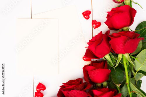 Red blooming roses on wood