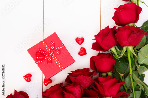 Red blooming roses on wood