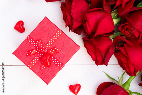 Red blooming roses on wood