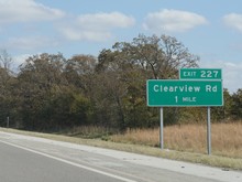 Roadside Sign With Distance To Clearview Road, Oklahoma.