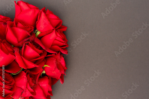 Red roses on black background