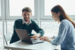 © SHOTPRIME STUDIO - man and woman working on laptop in office