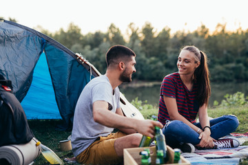 Wall Mural - friends having fun camping outdoor