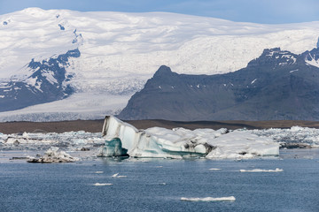 Wall Mural - Sunshine over Jokulsarlon glacier lake in Iceland