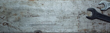 Steel Textured Metal Sheet With Rust And Wrenches Laid Out On It. Background Banner. Top View With Copy Space. Flat Lay