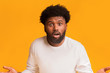 © Prostock-studio - Surprised bearded black man standing with open mouth