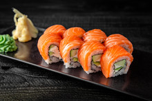 Sushi Roll (Philadelphia) With Salmon, Smoked Eel, Avocado, Cream Cheese On Black Background. Sushi Menu. Japanese Food.