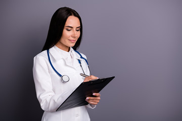 Poster - Close-up profile side view portrait of her she nice attractive lovely latin hispanic brunet girl experienced doc writing examining patient isolated on grey violet purple pastel color background