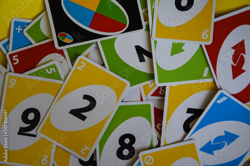 Fotomural Deck of Uno game cards scattered all over on a table