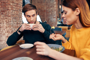 Wall Mural - young couple in cafe