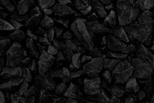 Natural Fire Ashes With Dark Grey Black Coals Texture. It Is A Flammable Black Hard Rock. Space For Text. 