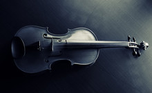 The Abstract Art Design Background Of Wooden Violin Put On Background,show Half Front Side Of String Instrument ,black And White Tone,on Black Canvas Background